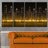 Made in Canada - Design Art 'Modern City with Illuminated Skyscrapers' 4 Piece Photographic Print on Wrapped Canvas Set