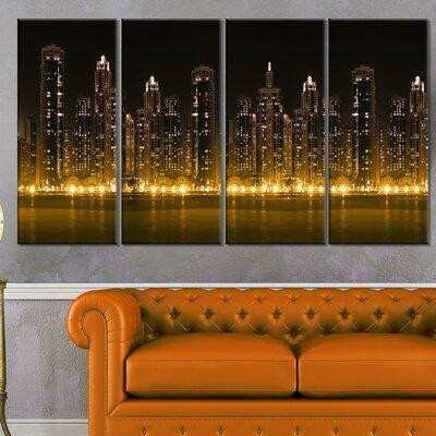 Made in Canada - Design Art 'Modern City with Illuminated Skyscrapers' 4 Piece Photographic Print on Wrapped Canvas Set in Arts & Collectibles