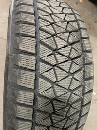 4 pneus d'hiver P245/55R19 103T Bridgestone Blizzak DM-V2 35.0% d'usure, mesure 12-9-6-7/32