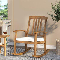 August Grove Skien Outdoor Rocking Solid Wood Chair with Cushions