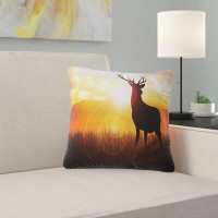 East Urban Home Animal Deer on Meadow During Sunrise Pillow