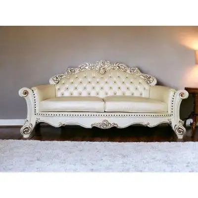 Sed98 This 96 champagne faux leather and pearl sofa with five toss pillows is made from sturdy and r...