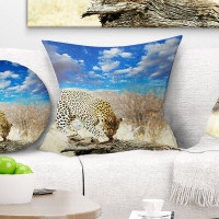 Made in Canada - East Urban Home African Leopard Feeding on Tree Trunk Pillow