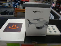 DJI Mini 2 SE Quadcopter Drone with Remote Control comes with landing pad and 2 extra batteries