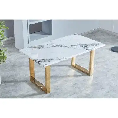 The luxurious faux marble MDF dining table is a perfect blend of modern design and practicality maki...