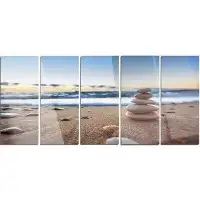 Design Art 'Stones Balance on Sandy Beach' Photograph Multi-Piece Image on Metal