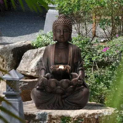 Enhance your space with this mystical Zen-style meditative Buddha statue fountain. It features handc...