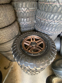 SET OF FOUR LIKE NEW 20 INCH BRONZE 4WP WHEELS !! 6X135 !! MOUNTED WITH 35x12.50R20 MAZZINI MUD TIRES !!