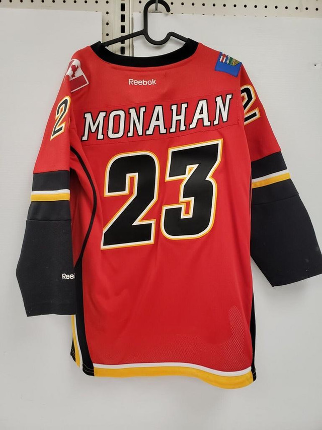 (48505-1) Reebok Calgary Flames Jersey- #23 Monahan - Youth L/XL in Hockey in Alberta - Image 2