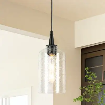 This 1-light single pendant brings a touch of modern and minimalist style as it shines. It's made fr...