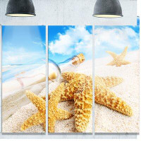 Design Art 'Message in Bottle Buried in Sand' Photograph Multi-Piece Image on Metal