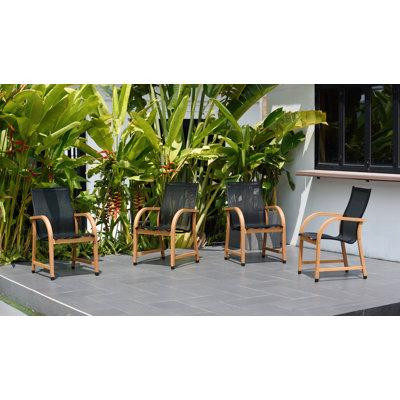 Wrought Studio Chaise de patio empilable en teck 4 pièces Petit in Chairs & Recliners in Québec