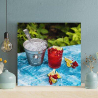 Latitude Run® Ice Cream In Clear Drinking Glass With Strawberry And White Cream On Blue Table - 1 Piece Square Graphic A